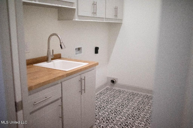 256 Arbor Trl, Brandon, MS 39047 - washroom featuring cabinet space, hookup for a washing machine, and tile patterned floors