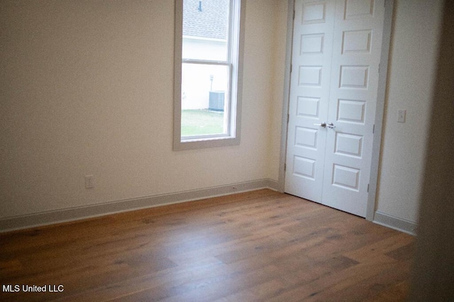 256 Arbor Trl, Brandon, MS 39047 - unfurnished bedroom featuring a closet, light wood-type flooring, and baseboards