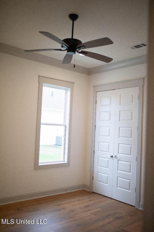 256 Arbor Trl, Brandon, MS 39047 - unfurnished bedroom with a closet, wood finished floors, ceiling fan, and baseboards
