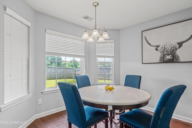 275 Magnolia Gardens Dr, Hernando, MS 38632 - dining room with dark wood-type flooring and a chandelier