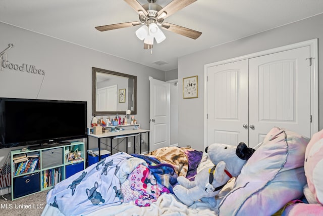 275 Magnolia Gardens Dr, Hernando, MS 38632 - bedroom featuring a closet, ceiling fan, and carpet flooring
