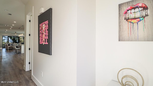 hallway featuring dark wood-type flooring