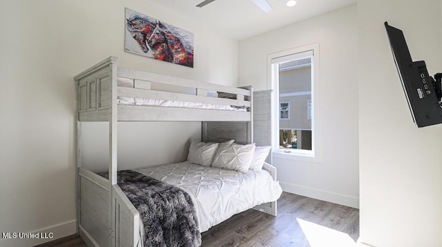 bedroom with hardwood / wood-style floors and ceiling fan