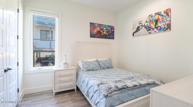 bedroom with hardwood / wood-style flooring