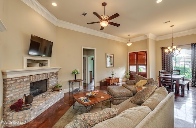 living room with ornamental molding, a fireplace, ceiling fan with notable chandelier, and visible vents