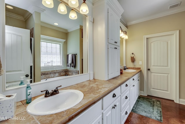 bathroom featuring double vanity, visible vents, ornamental molding, and a sink