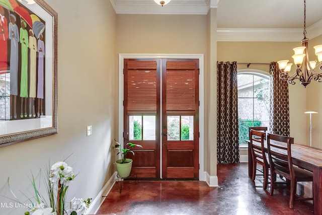 entrance foyer with baseboards, an inviting chandelier, and ornamental molding