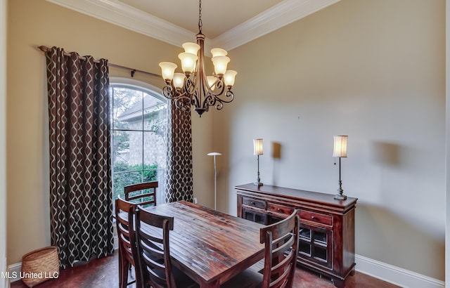 dining room with an inviting chandelier, baseboards, and crown molding