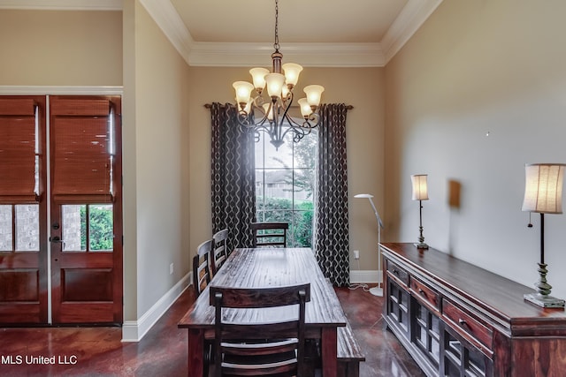 dining room featuring baseboards, ornamental molding, concrete flooring, and a chandelier