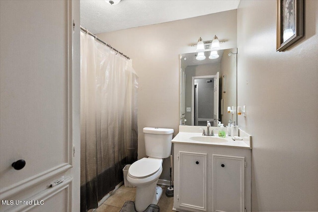 bathroom with toilet, vanity, tile patterned flooring, and a shower with curtain