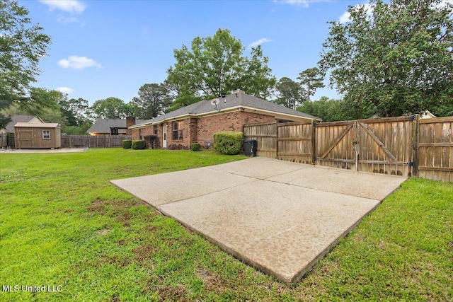 view of patio / terrace with a gate, a shed, and an outbuilding