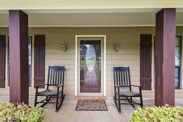 doorway to property featuring covered porch