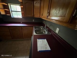 kitchen featuring sink and tile patterned floors