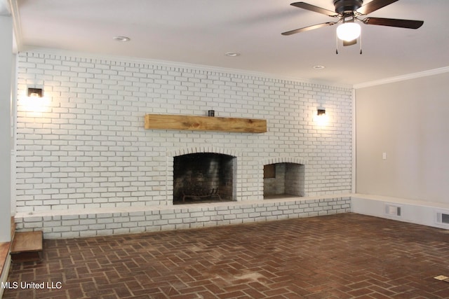 unfurnished living room with ornamental molding, a fireplace, and ceiling fan