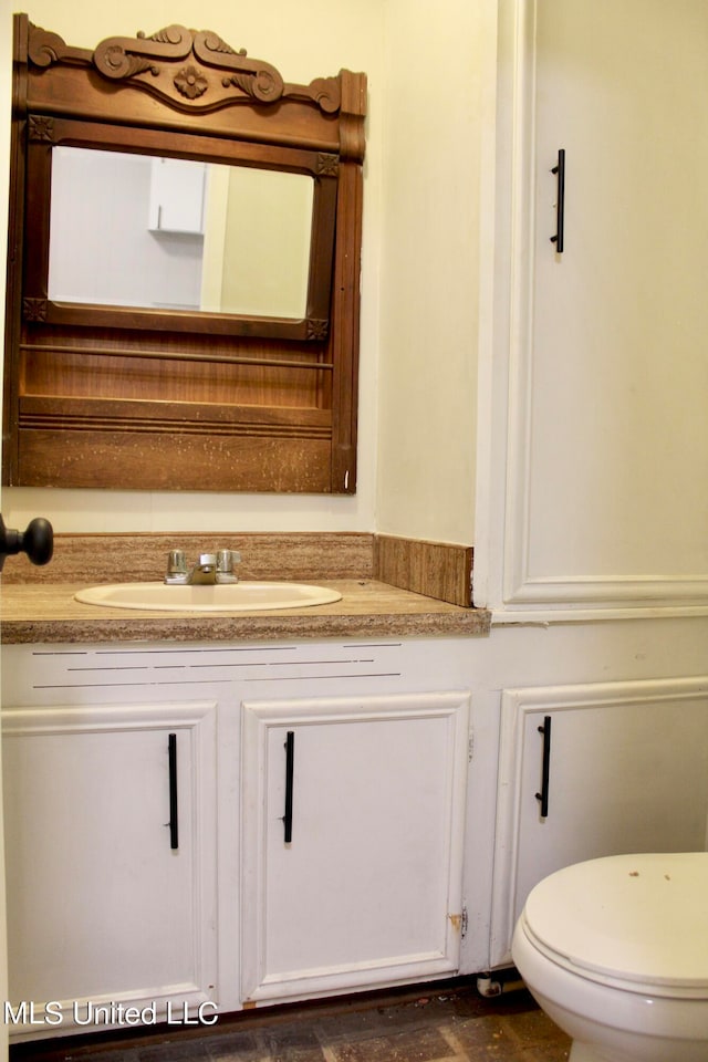 bathroom with vanity and toilet