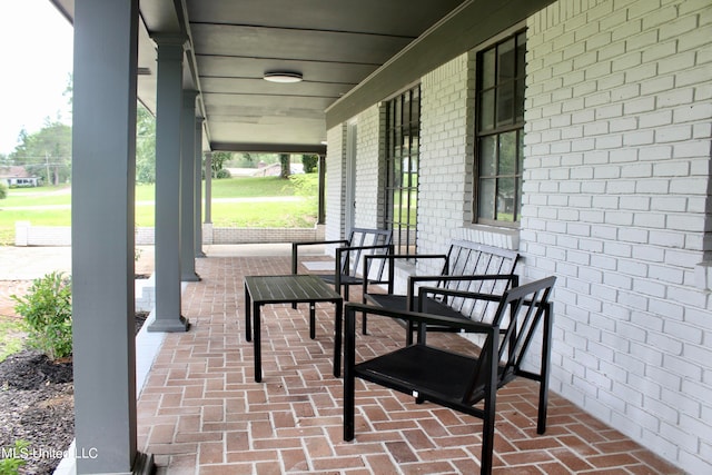 view of patio featuring a porch