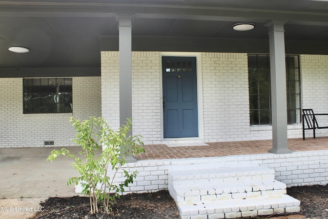 doorway to property with a porch