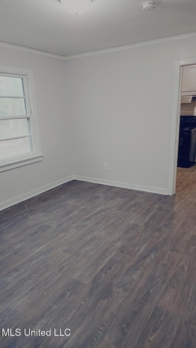 unfurnished room with dark hardwood / wood-style floors and ornamental molding