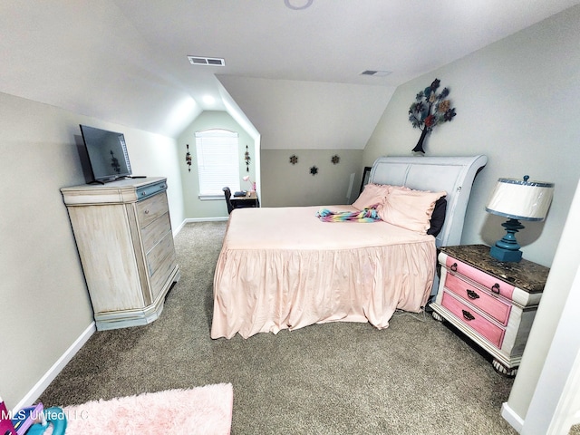 bedroom featuring vaulted ceiling and dark colored carpet