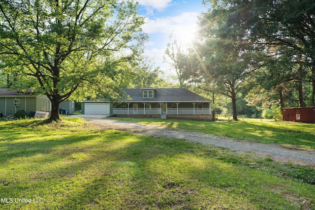 farmhouse-style home with a garage, a front lawn, and driveway