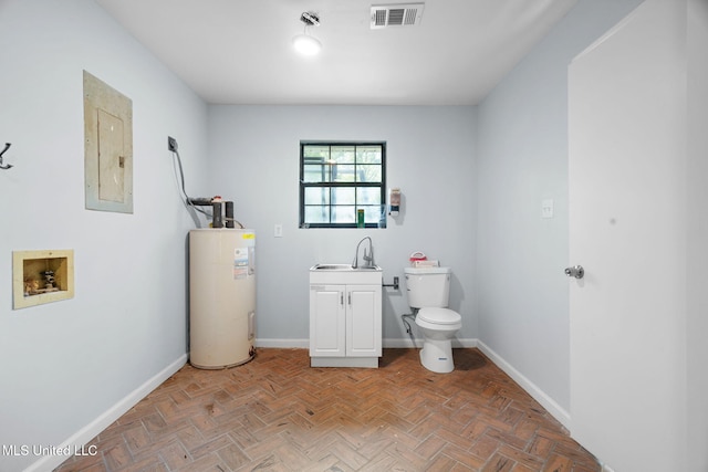 bathroom featuring electric panel, visible vents, baseboards, toilet, and electric water heater