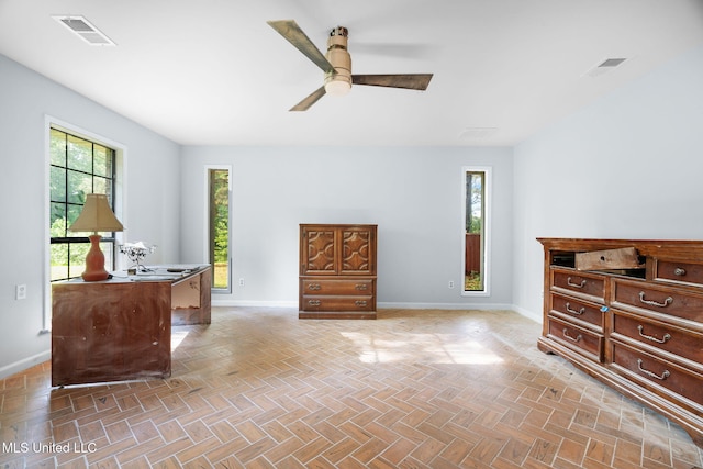 interior space with baseboards and visible vents