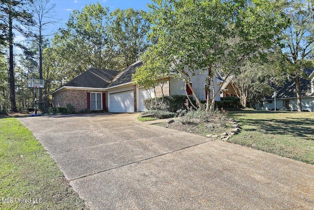 view of front of home with a front yard and a garage