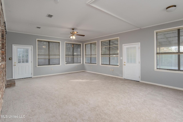 interior space with a ceiling fan and visible vents