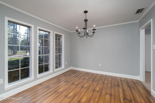 unfurnished dining area with crown molding, baseboards, dark wood finished floors, and a notable chandelier