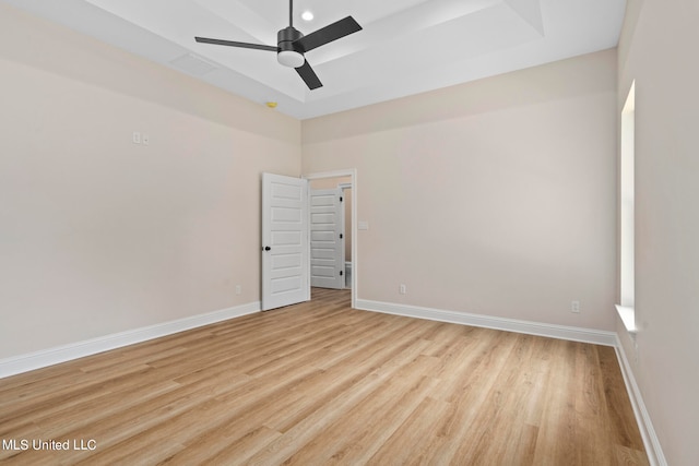 empty room with ceiling fan and light wood-type flooring