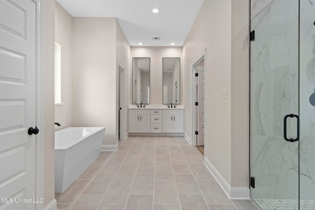 bathroom featuring vanity, independent shower and bath, and tile patterned floors