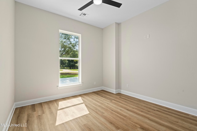 unfurnished room with light hardwood / wood-style flooring and ceiling fan