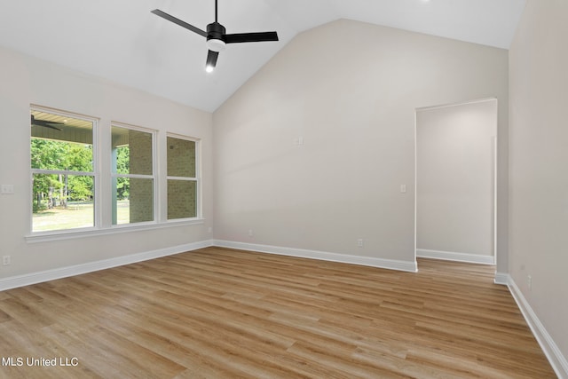 spare room with high vaulted ceiling, light hardwood / wood-style floors, and ceiling fan