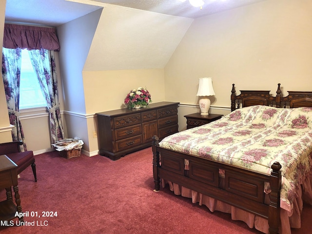 bedroom featuring carpet and vaulted ceiling