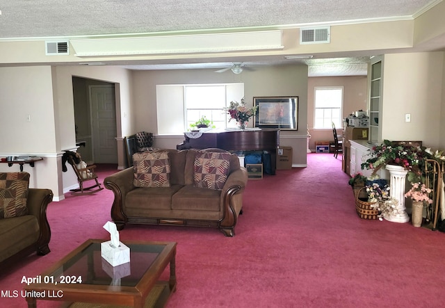 living room with ornamental molding, carpet flooring, a textured ceiling, and ceiling fan