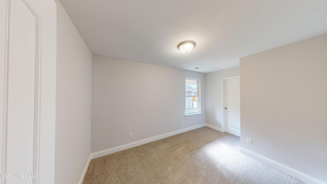 empty room with light colored carpet