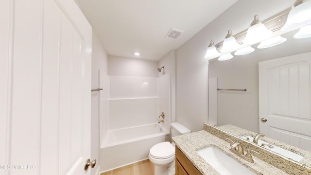 full bathroom with vanity, wood-type flooring,  shower combination, and toilet