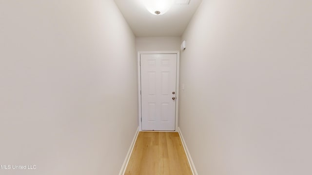 corridor featuring light hardwood / wood-style floors