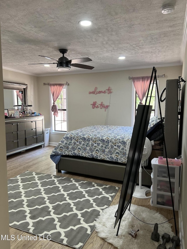 110 Hawks Nest Cv, Brandon, MS 39042 - bedroom with a textured ceiling, wood finished floors, crown molding, a ceiling fan, and recessed lighting