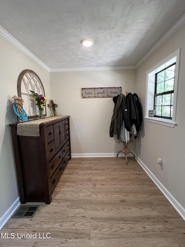 110 Hawks Nest Cv, Brandon, MS 39042 - hallway featuring wood finished floors, ornamental molding, and a textured ceiling