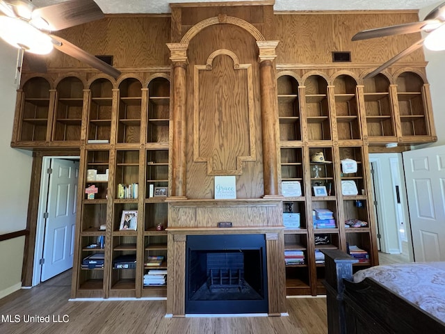 110 Hawks Nest Cv, Brandon, MS 39042 - unfurnished living room with ceiling fan, wood finished floors, and a fireplace