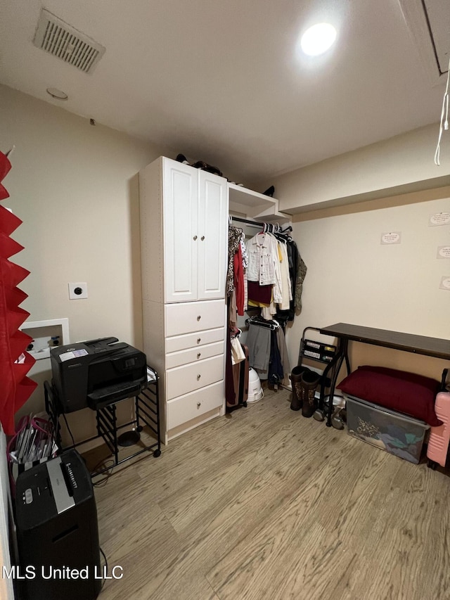 110 Hawks Nest Cv, Brandon, MS 39042 - walk in closet featuring light wood-style floors and attic access