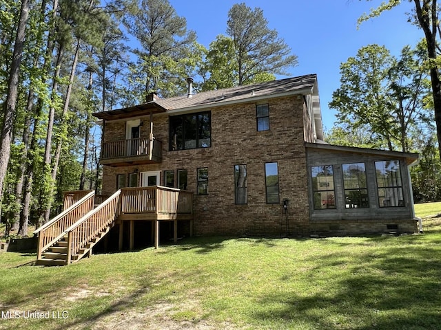110 Hawks Nest Cv, Brandon, MS 39042 - back of property featuring a balcony, a lawn, and brick siding