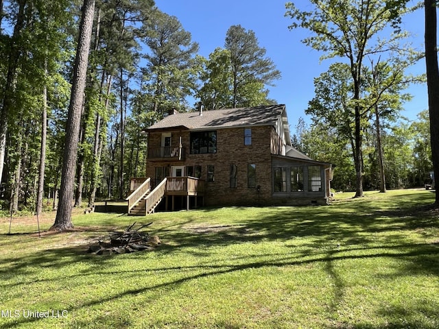 110 Hawks Nest Cv, Brandon, MS 39042 - back of house with a sunroom, stairs, and a lawn