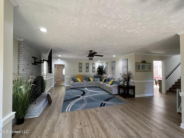 110 Hawks Nest Cv, Brandon, MS 39042 - living area with a textured ceiling, wood finished floors, recessed lighting, a ceiling fan, and stairs