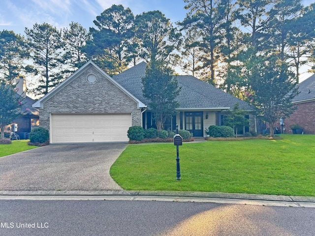 view of front facade featuring a front yard and a garage