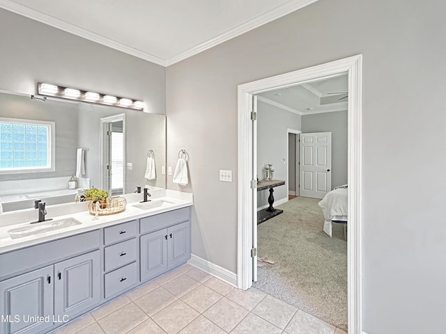 bathroom with tile patterned flooring, vanity, ornamental molding, and a tub