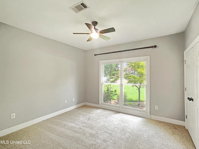 carpeted empty room with ceiling fan