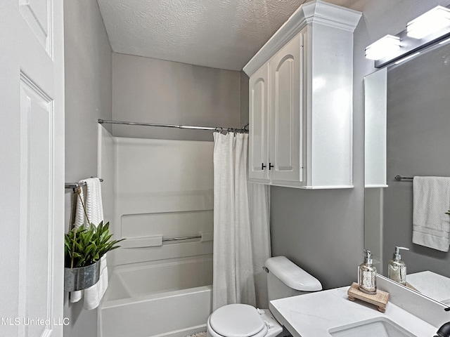 full bathroom featuring a textured ceiling, vanity, shower / tub combo, and toilet