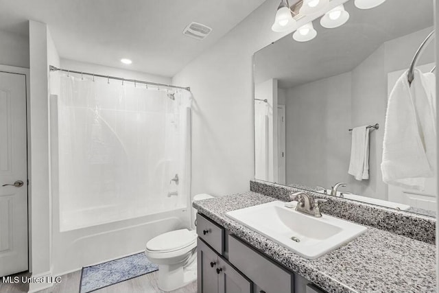 full bathroom with shower / bath combination with curtain, vanity, toilet, and hardwood / wood-style floors